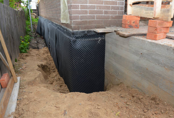 SJ Waterproofing Pros technician performing targeted Basement Waterproofing assessment in Bethpage, NY